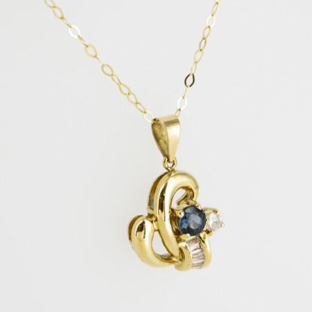 Colgante de oro 18 kt. con diamantes y zafiro