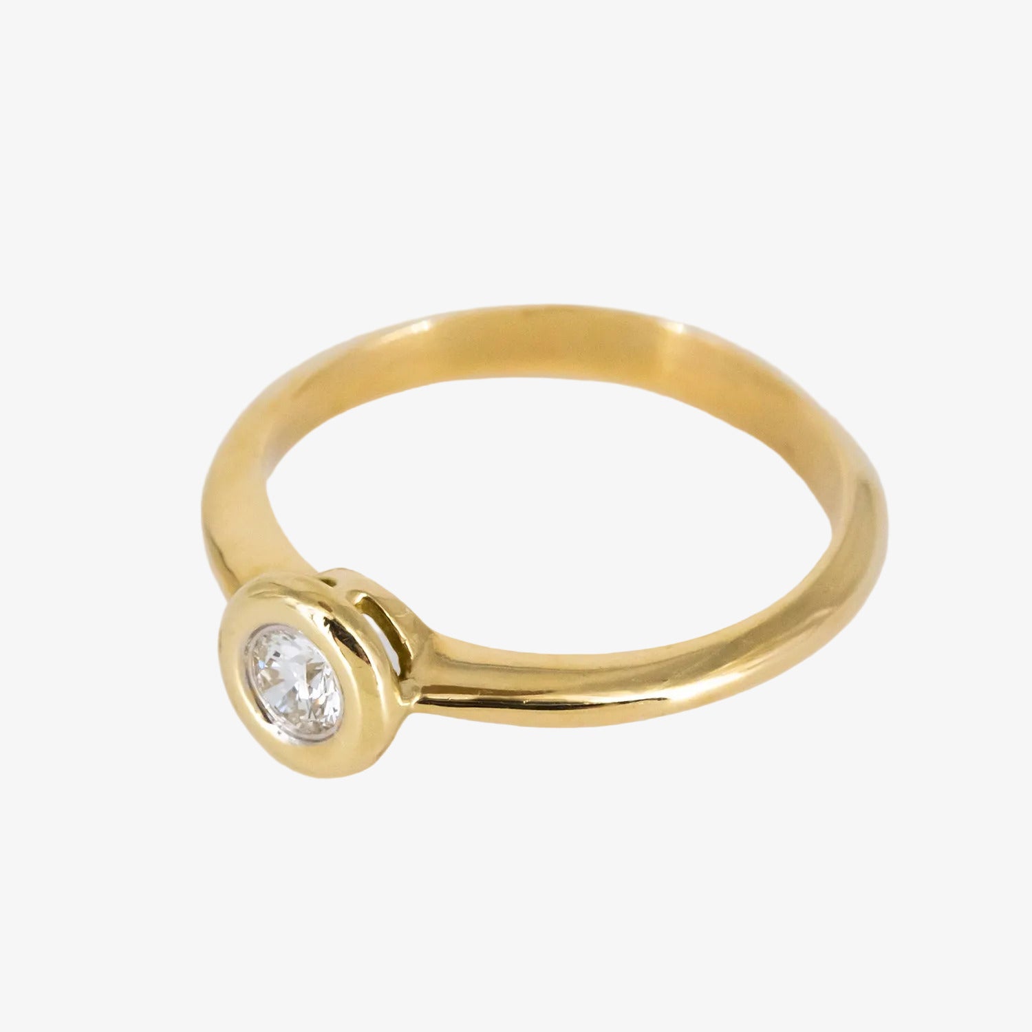 Solitario de oro 18 kt. con diamante talla brillante