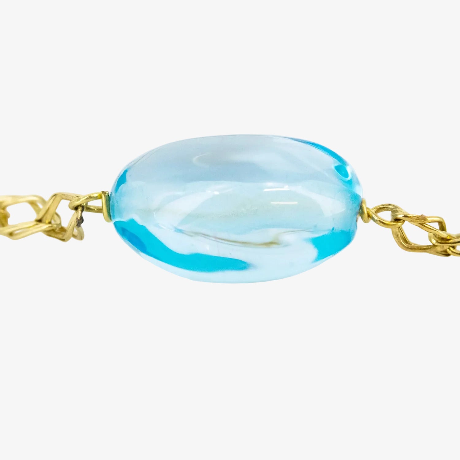Pulsera de oro de 18 kt. con topacios azules ovalados
