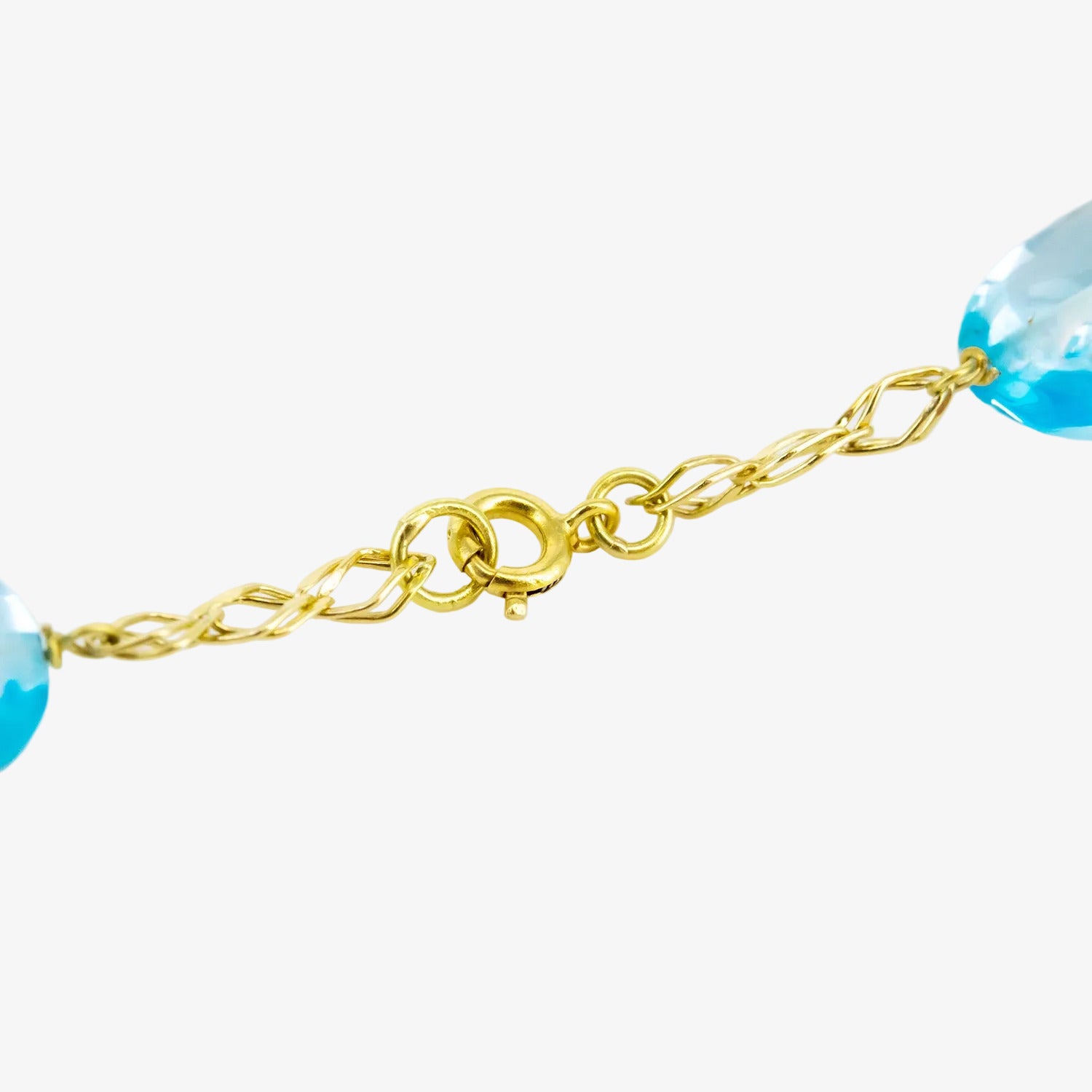 Pulsera de oro de 18 kt. con topacios azules ovalados