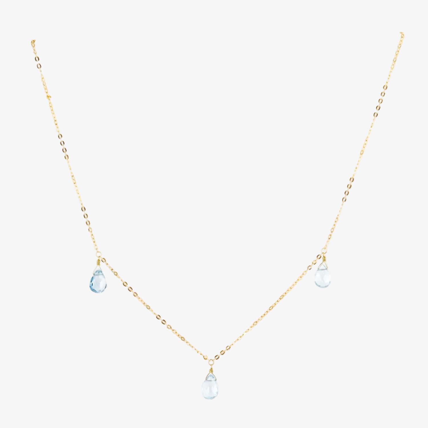 Gargantilla de oro 18 kt. con tres topacios azules