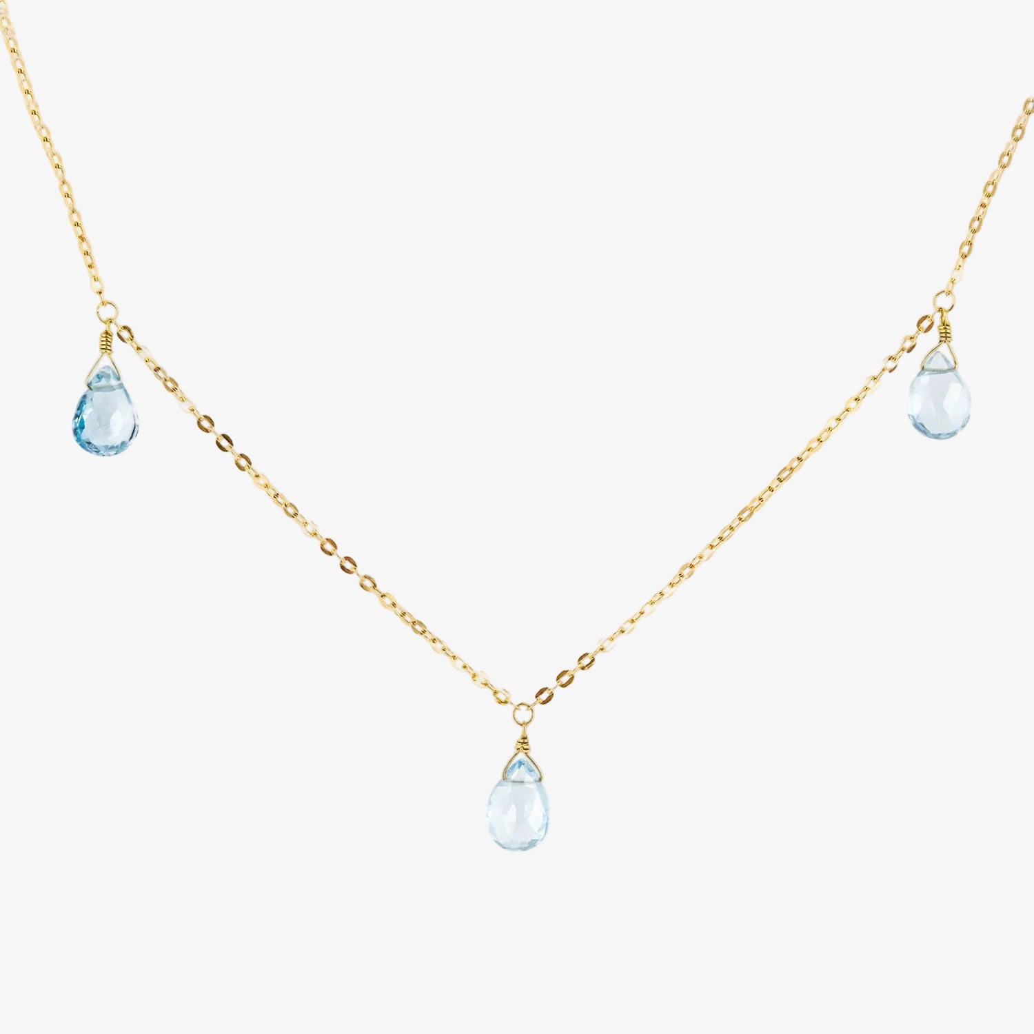 Gargantilla de oro 18 kt. con tres topacios azules