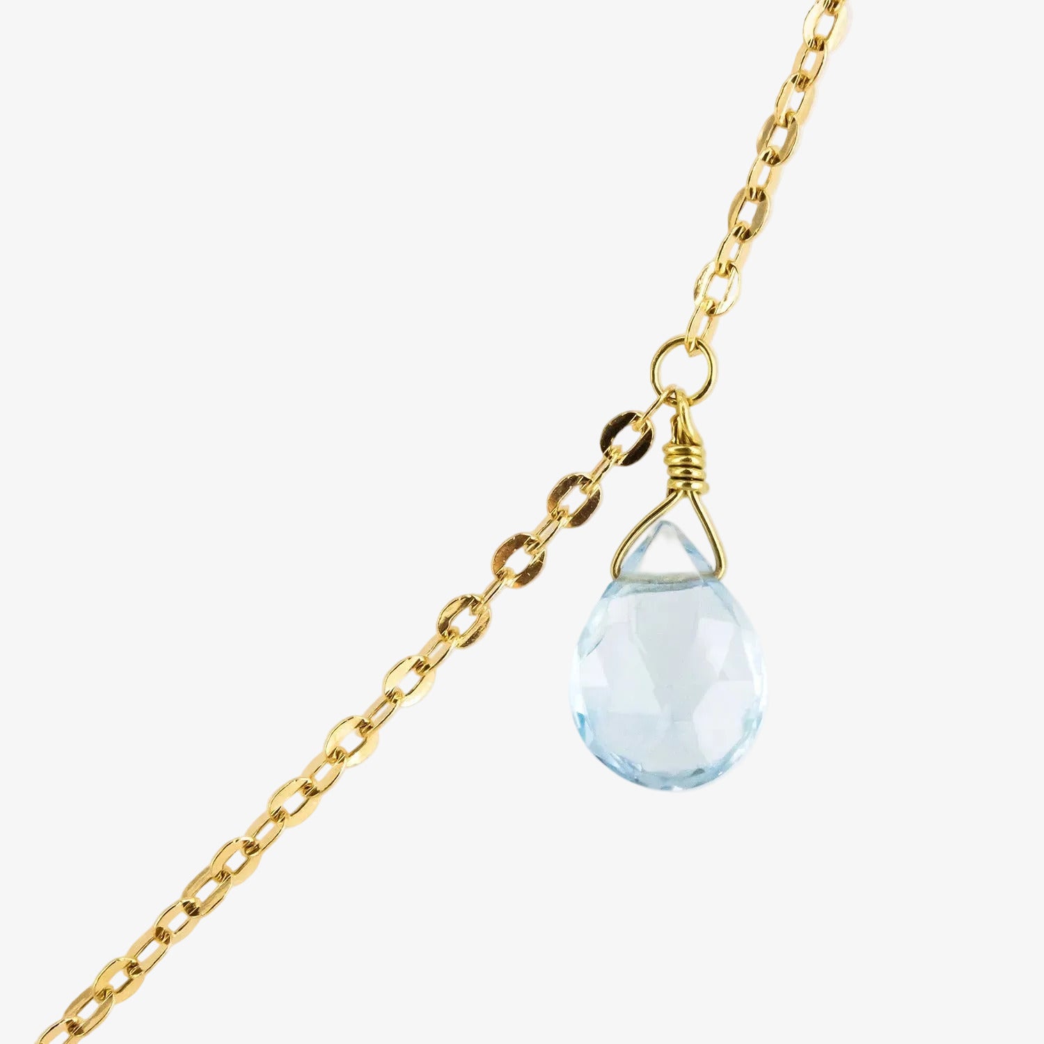 Gargantilla de oro 18 kt. con tres topacios azules