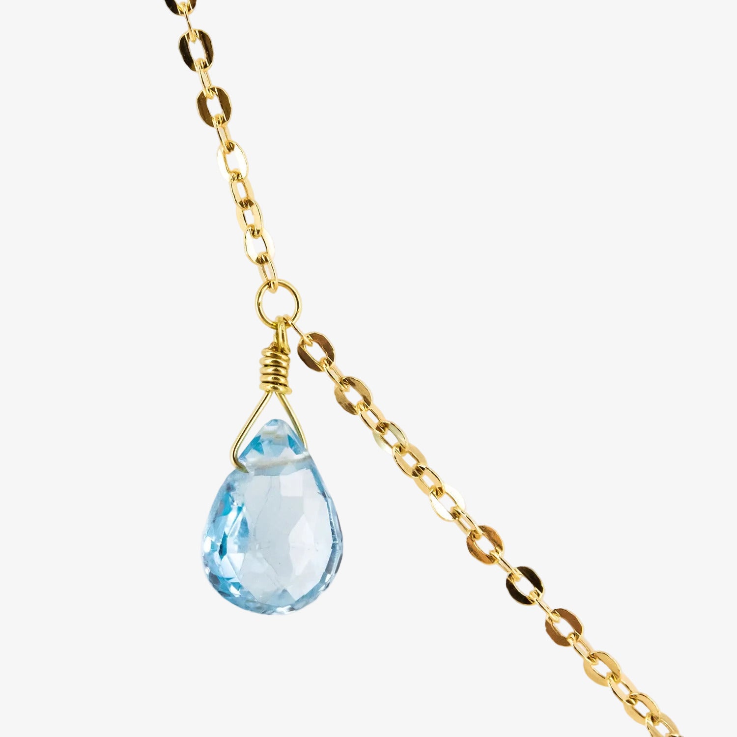 Gargantilla de oro 18 kt. con tres topacios azules