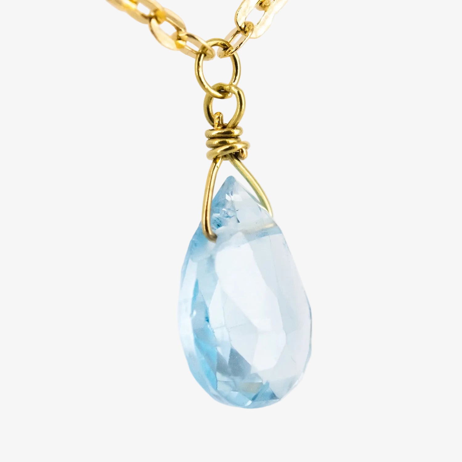 Gargantilla de oro 18 kt. con tres topacios azules