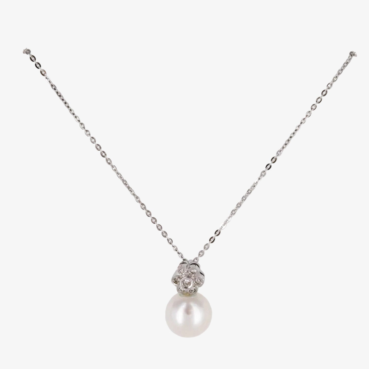 Colgante de oro blanco de 18 kt. con diamantes y perla australiana