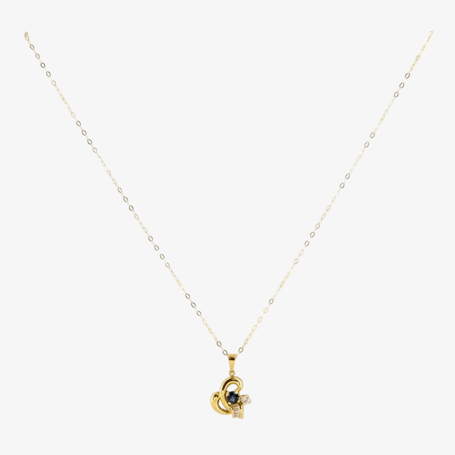 Colgante de oro 18 kt. con diamantes y zafiro