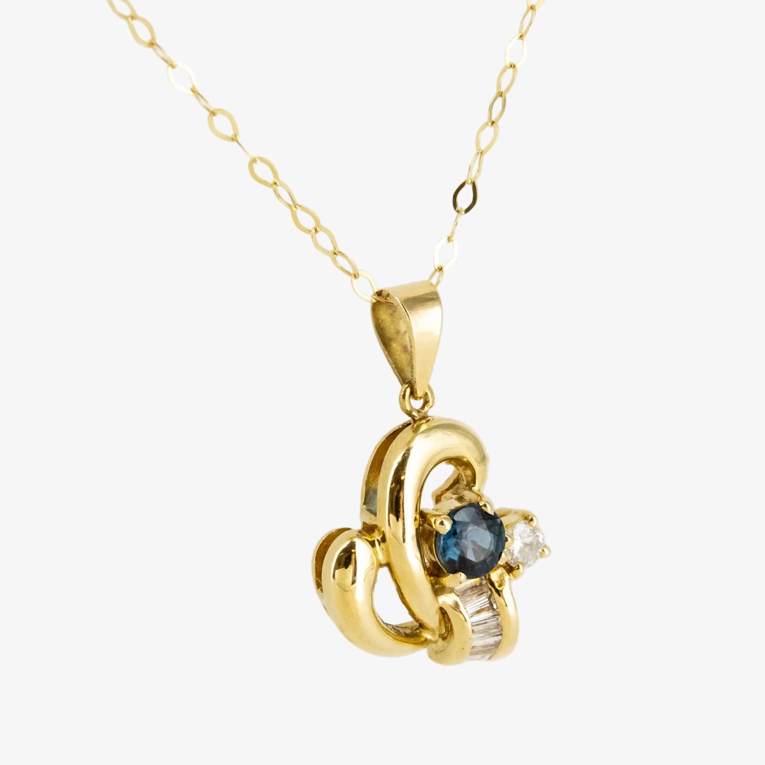Colgante de oro 18 kt. con diamantes y zafiro
