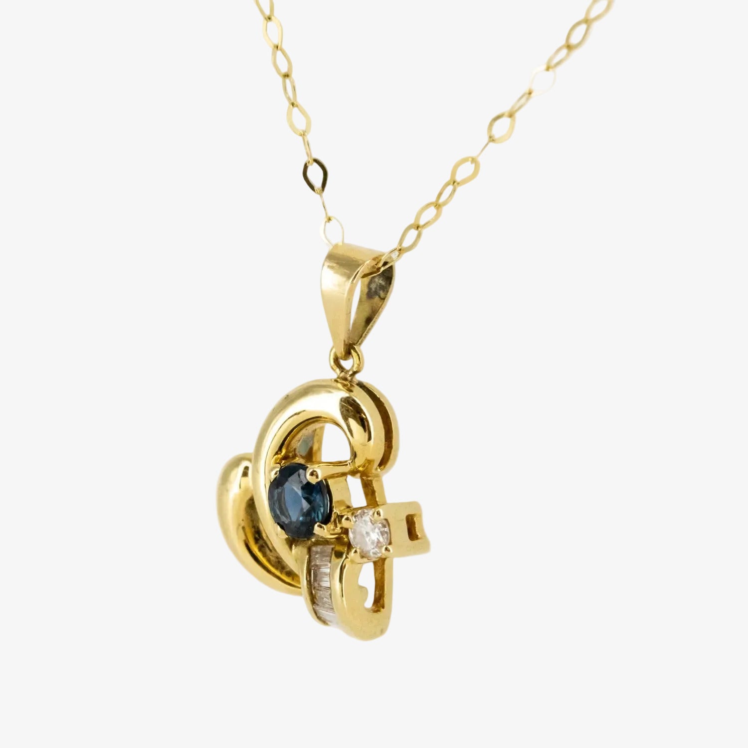 Colgante de oro 18 kt. con diamantes y zafiro