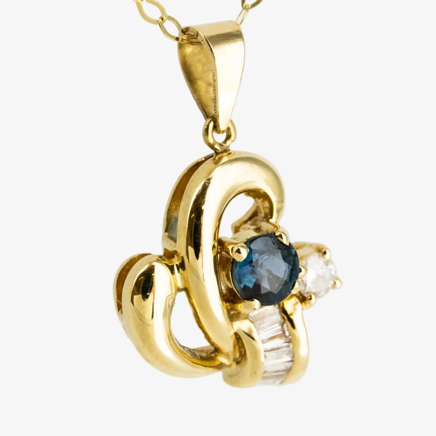 Colgante de oro 18 kt. con diamantes y zafiro