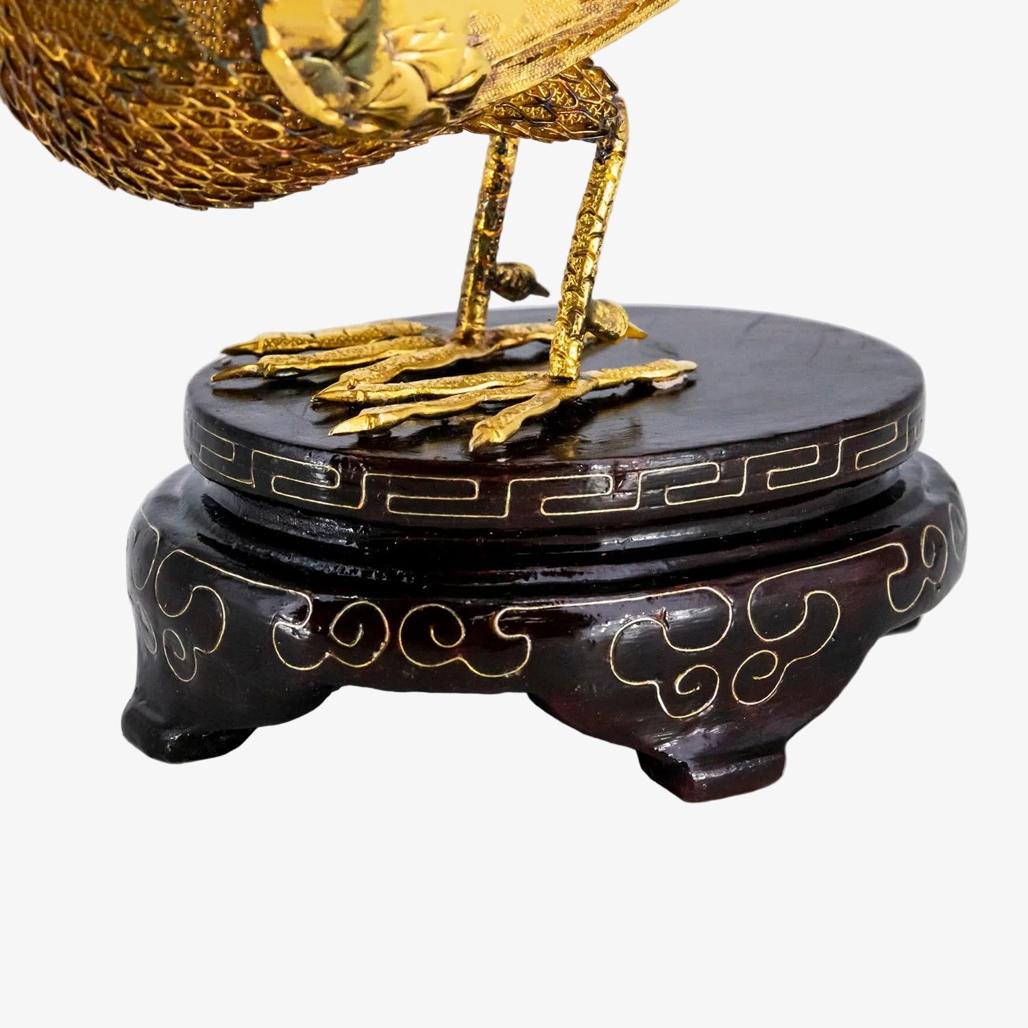 Figura decorativa con representación oriental de un ave fénix