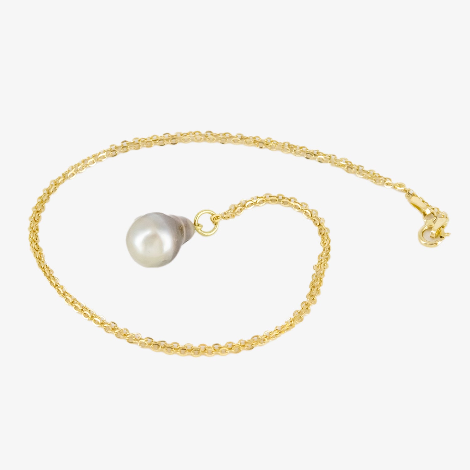 Set of 18 kt. gold pendant and earrings with diamonds and baroque Tahitian pearls