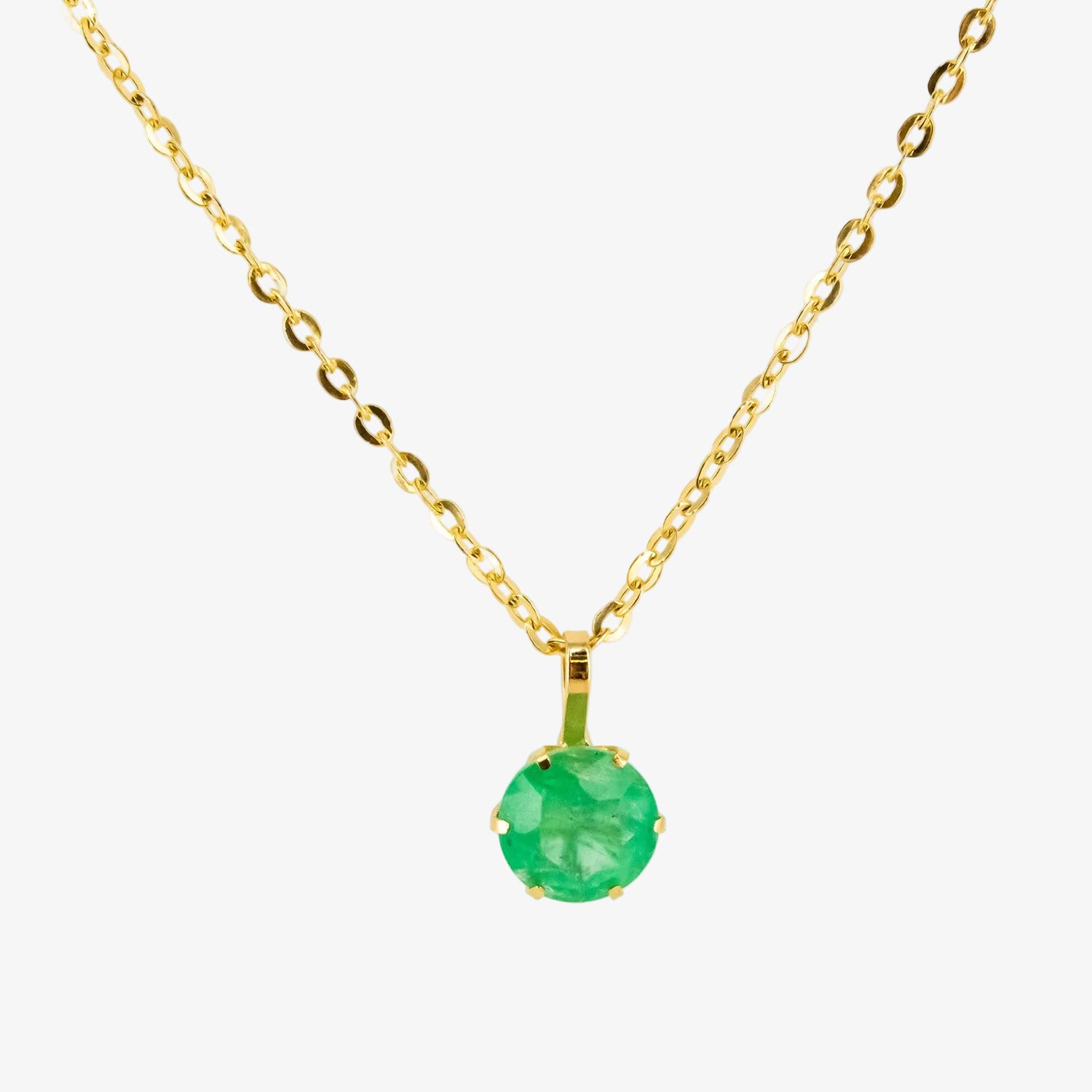 Colgante de oro 18 kt. con esmeralda de 0.60 ct.
