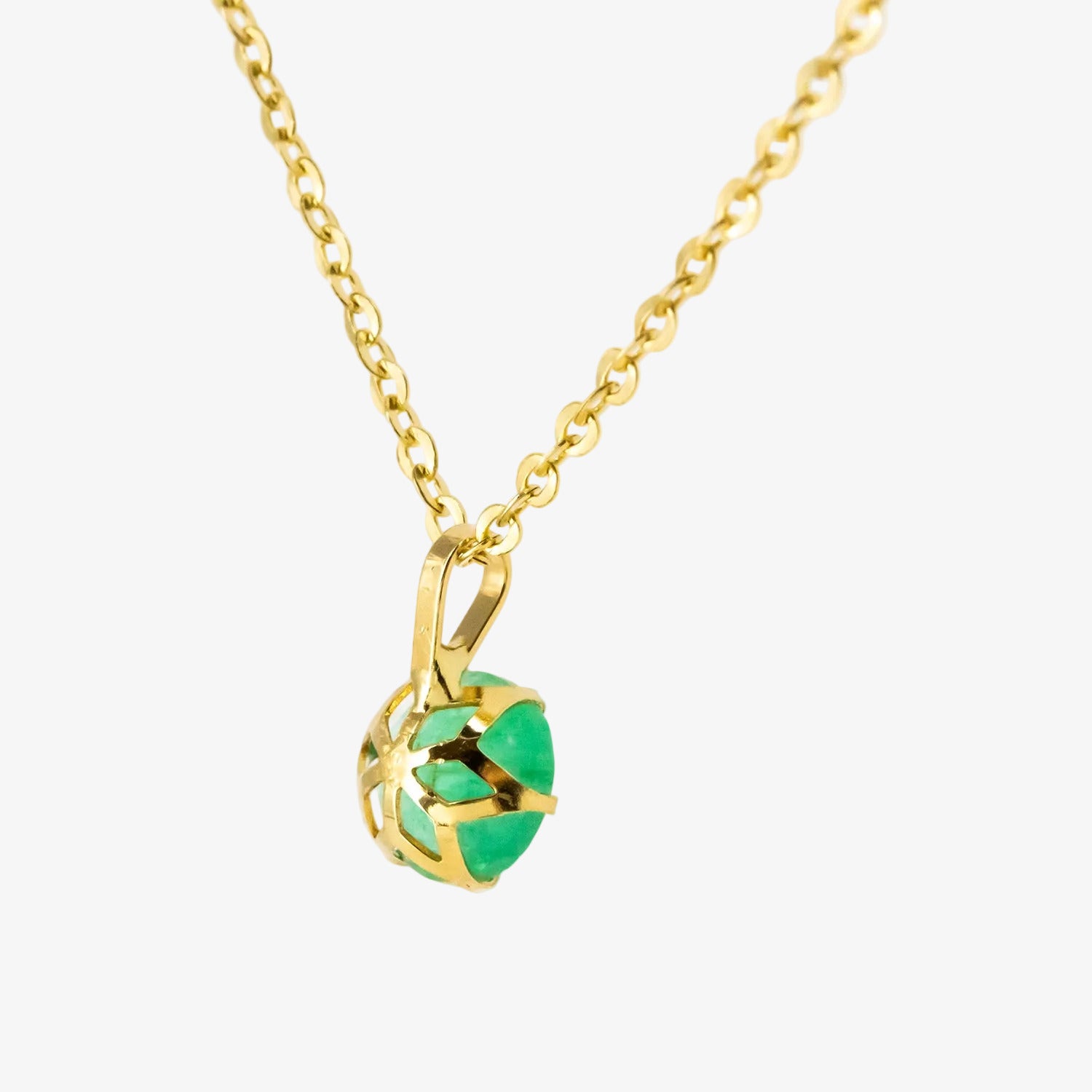 Colgante de oro 18 kt. con esmeralda de 0.60 ct.