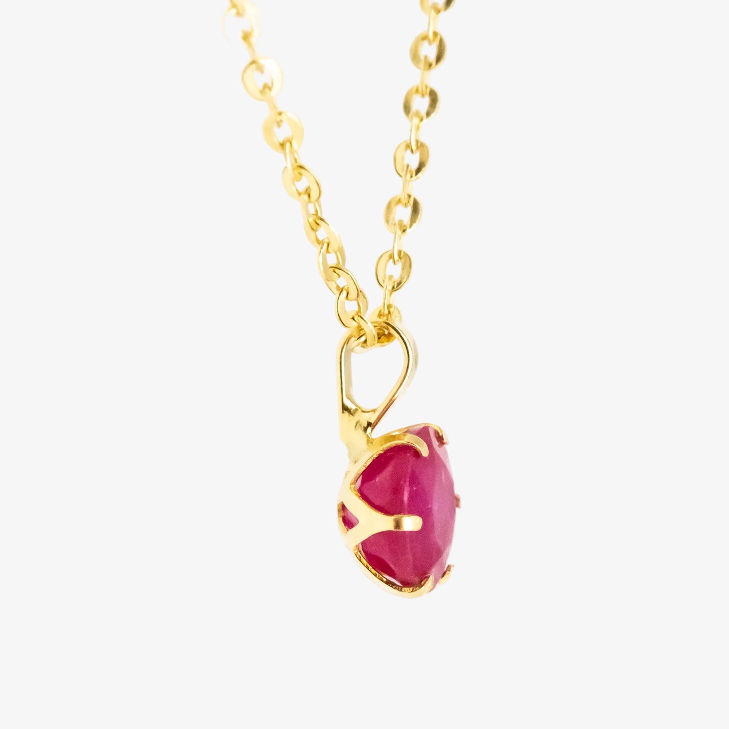 Colgante de oro 18 kt. con rubí de 0.60 ct.
