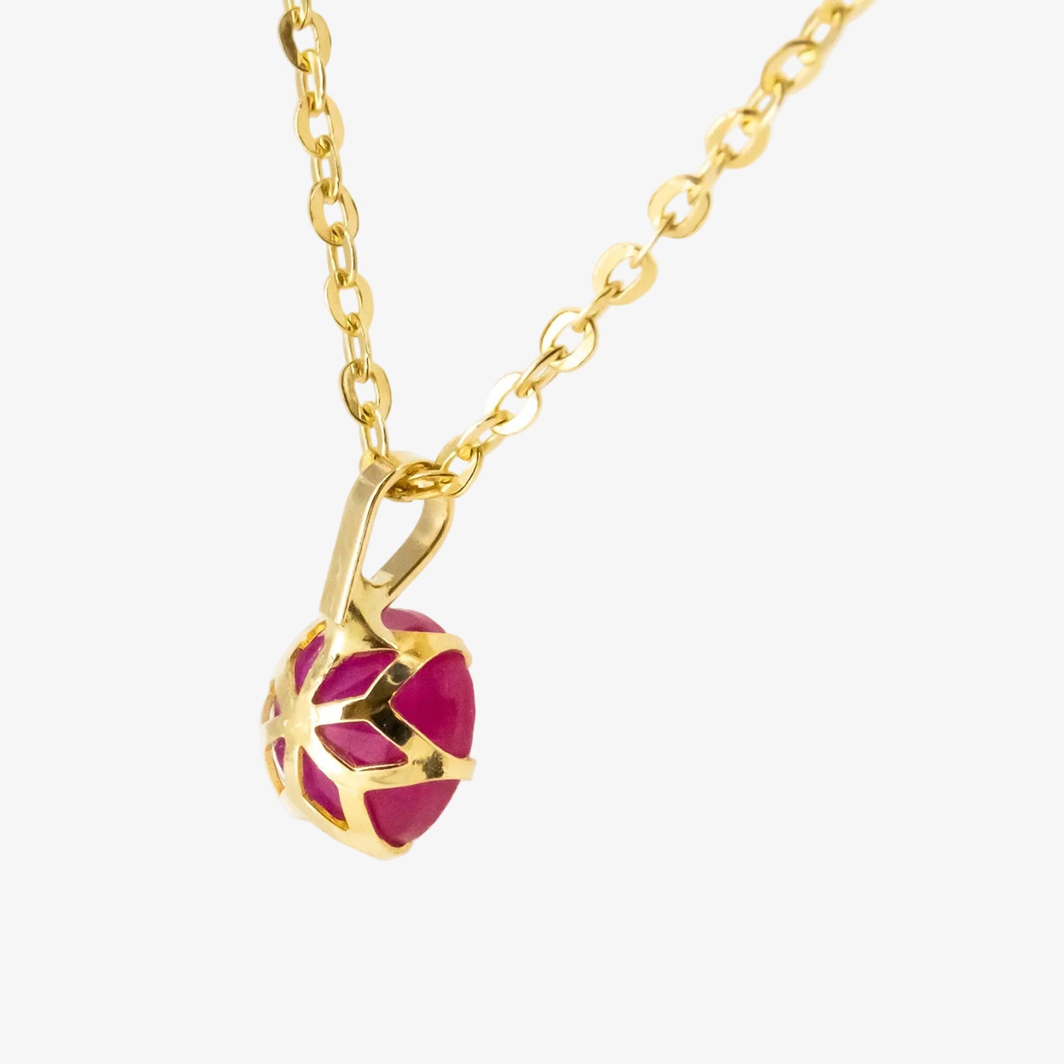 Colgante de oro 18 kt. con rubí de 0.60 ct.