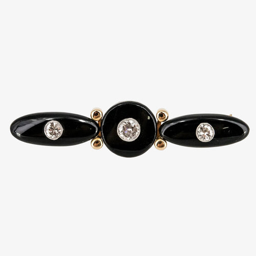 Broche vintage de oro bicolor 18 kt. con ónix y diamantes