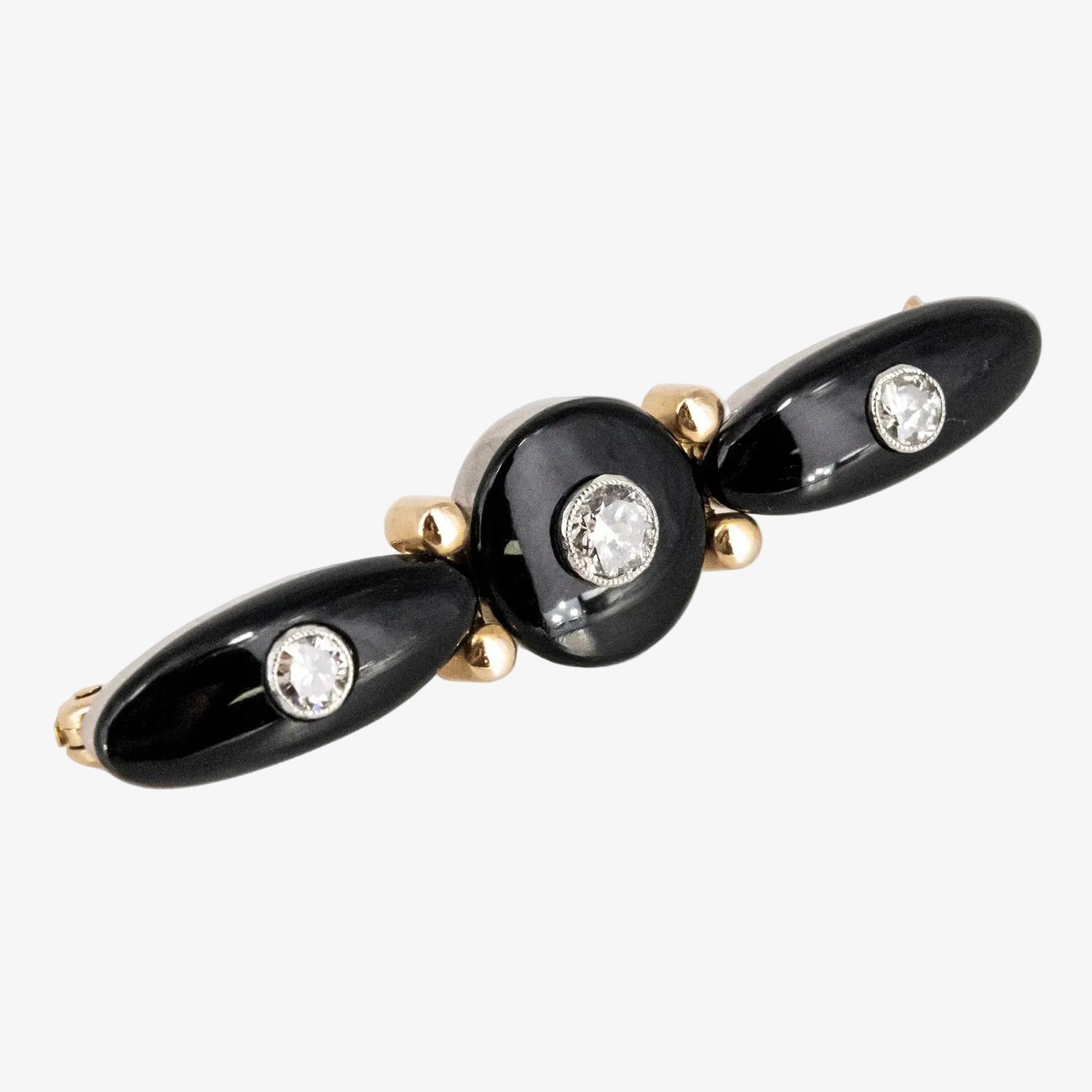 Broche vintage de oro bicolor 18 kt. con ónix y diamantes