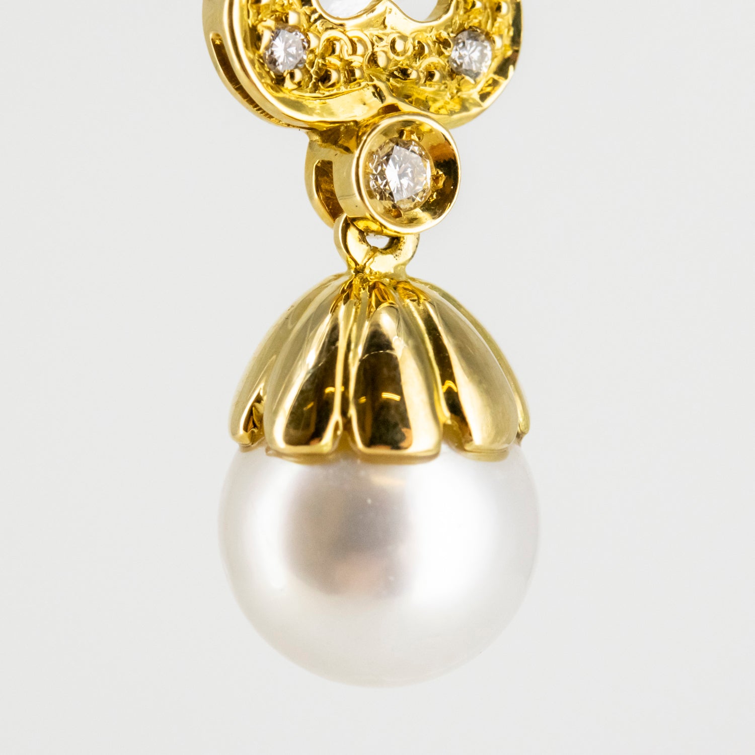Pendientes vintage de oro de 18 kt. con diamantes y perlas australianas